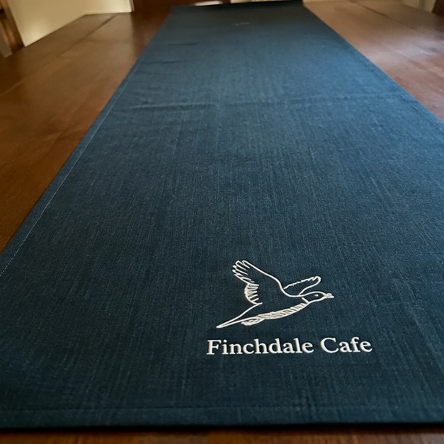 Table runners with logo — customer photo
